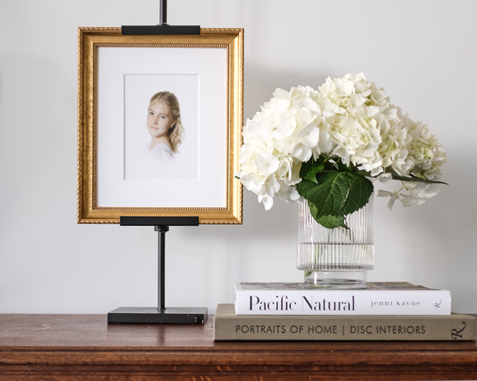 framed artwork displayed and a vase of flowers fom Heirloom Portrait session with photographer Caroline Eidson | Photographers in Tulsa OK