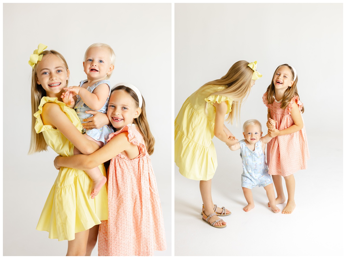 Bright and cheerful color portraits of three siblings laughing and playing together during a studio family photos Tulsa session with Caroline Eidson Portraits.