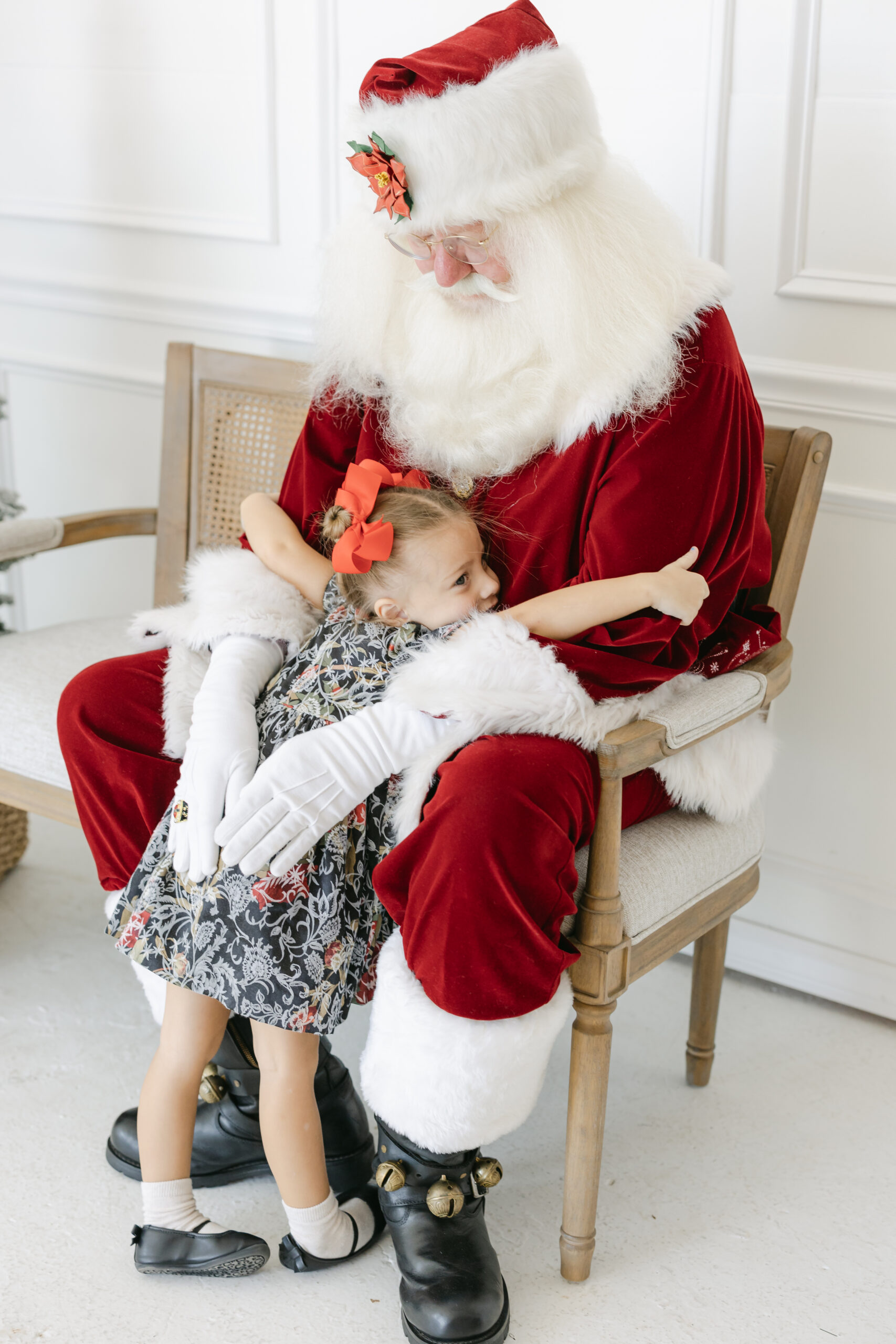 a child giving santa a big hug 