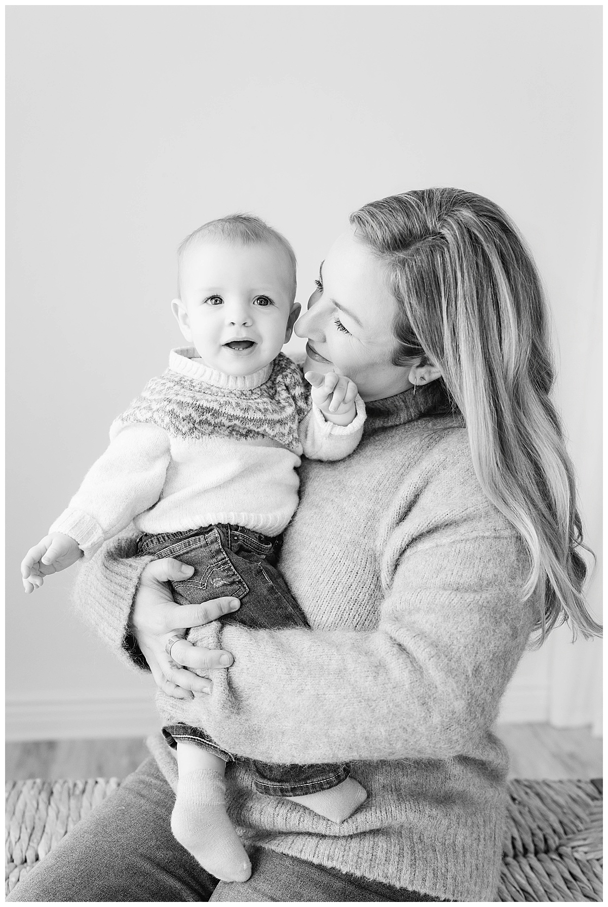 A family of six photographed together during a light and relaxed studio family portrait session in Tulsa, Oklahoma.